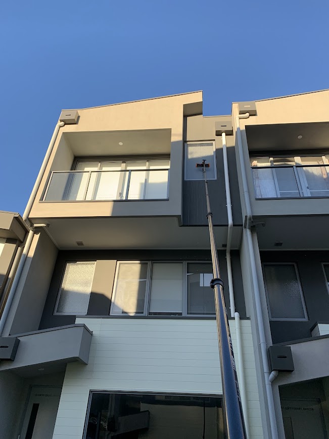 High-reach window cleaning using a water-fed pole in Cardinia